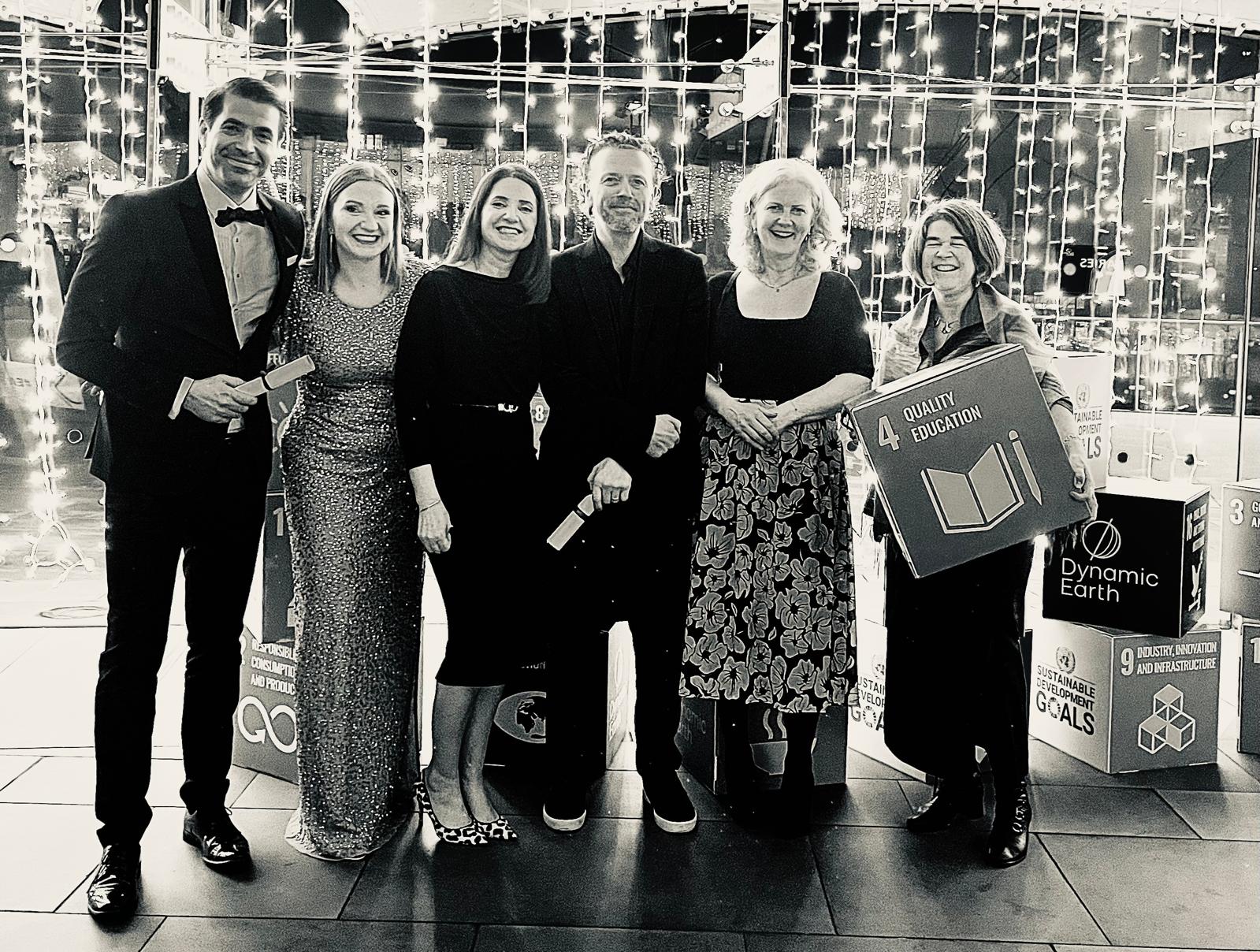 black and white photo of 6 TU Dublin staff posed in a row at the Green Gown award 2024