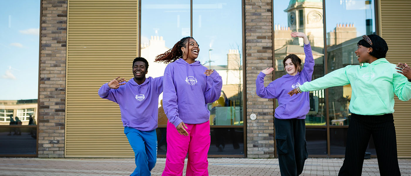 tu dublin students dancing in front of the East Quad building